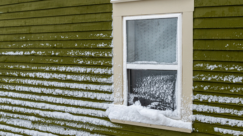 close up of window with snow